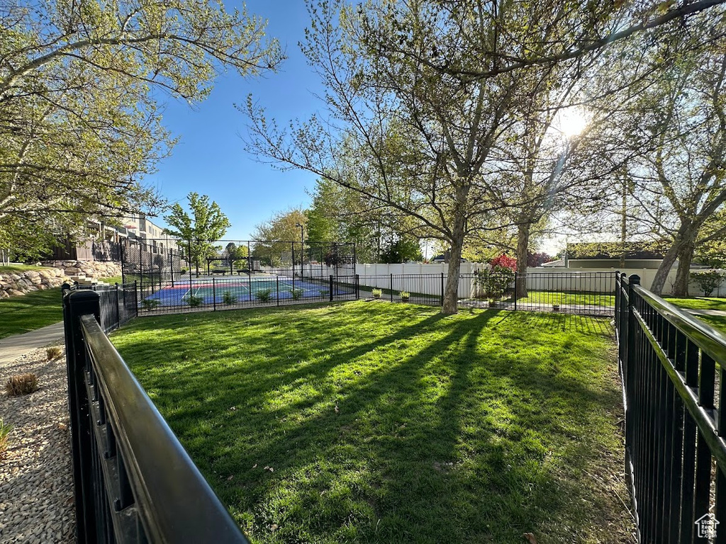 View of yard featuring fence