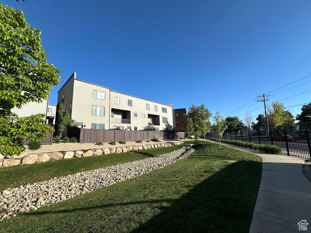 View of yard featuring fence