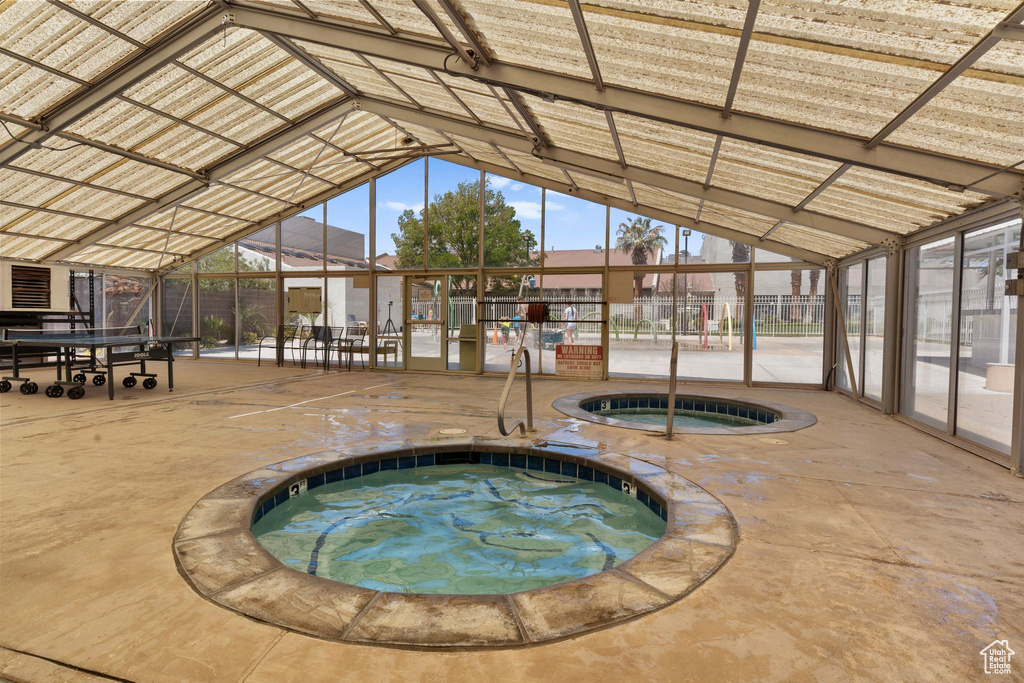 View of pool featuring a hot tub