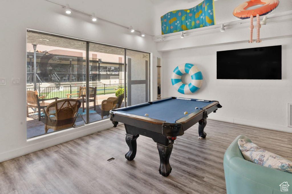 Playroom with wood finished floors, baseboards, pool table, and visible vents