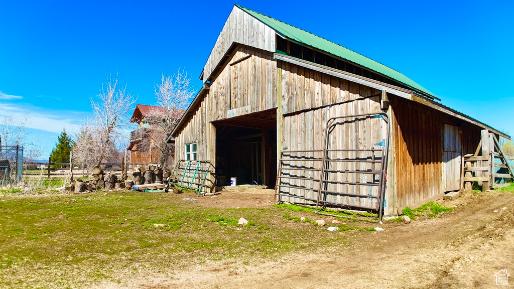 View of barn with fence