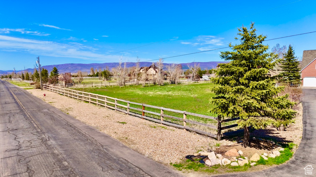 Property view of mountains with a rural view