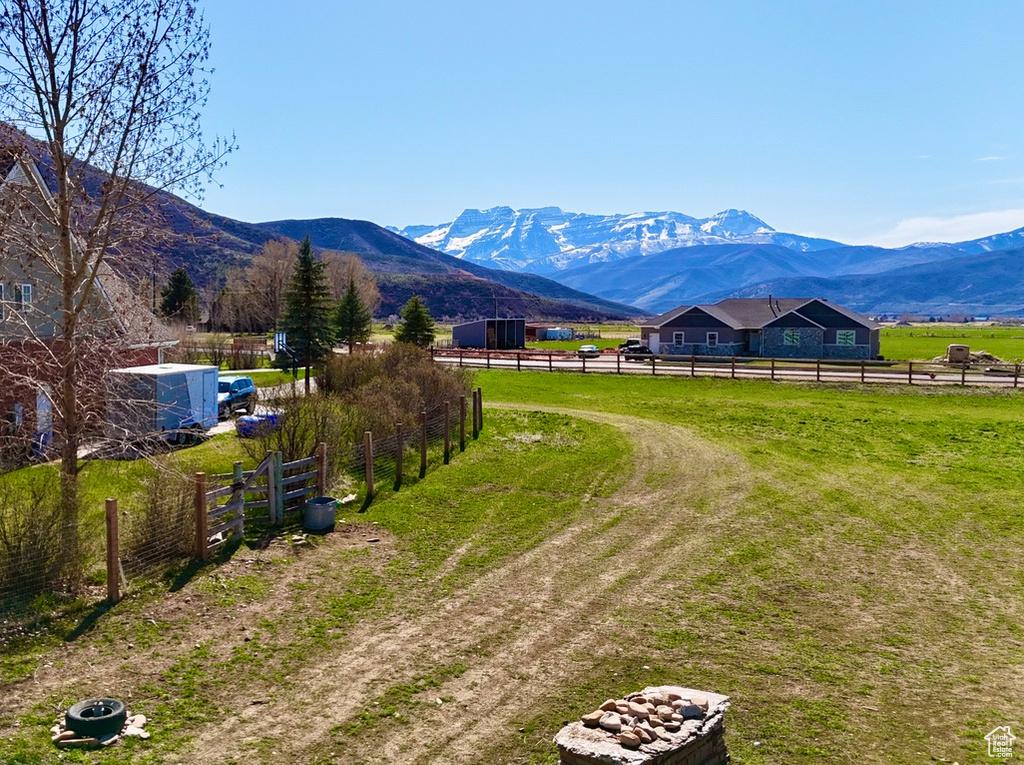 Property view of mountains with a rural view