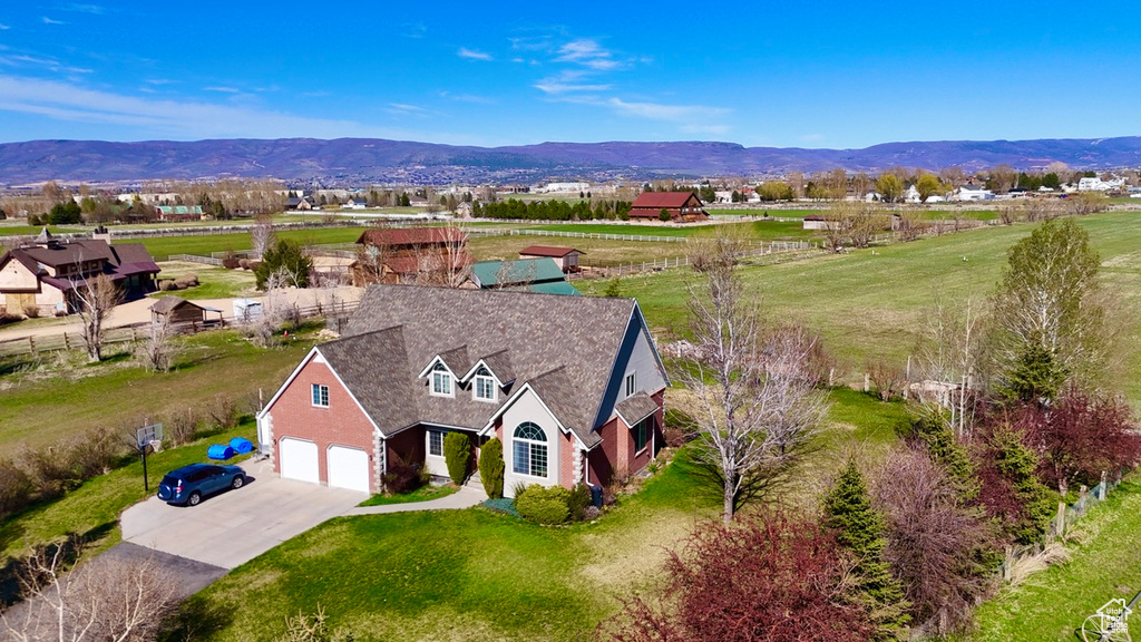 Birds eye view of property featuring a mountain view and a rural view