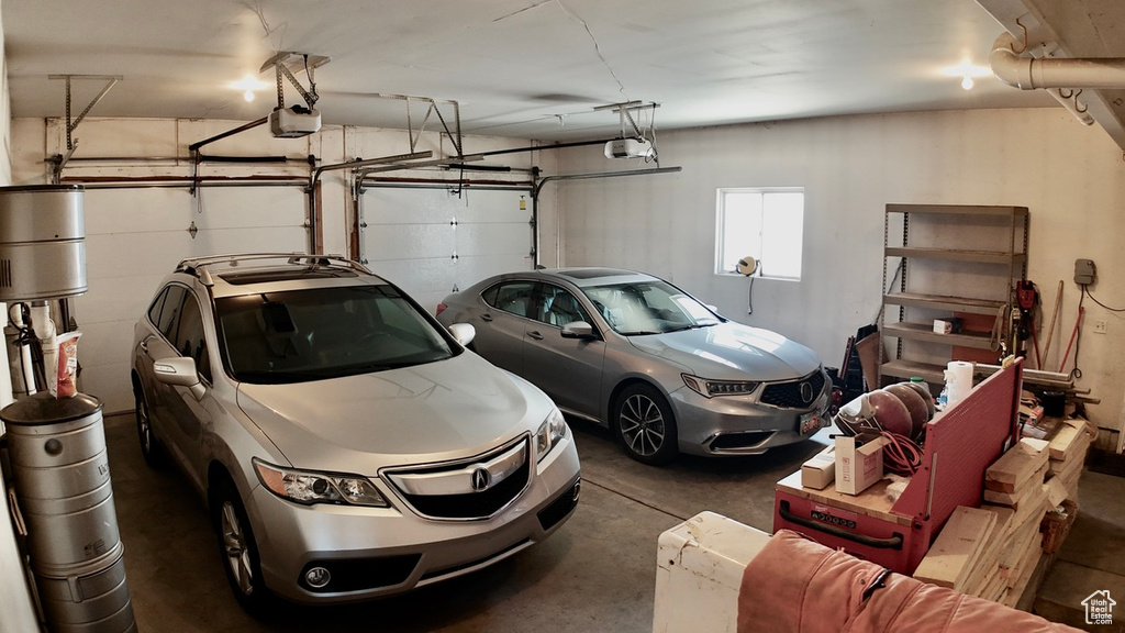 Garage featuring a garage door opener