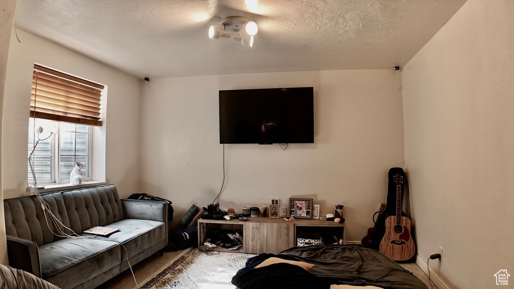 Living area featuring a textured ceiling