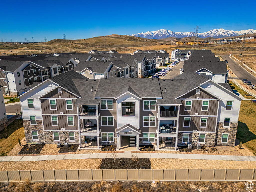 Birds eye view of property featuring a residential view and a mountain view