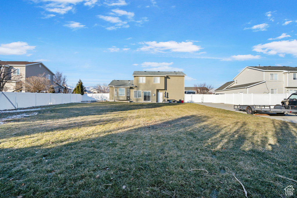 View of yard featuring a residential view and a fenced backyard