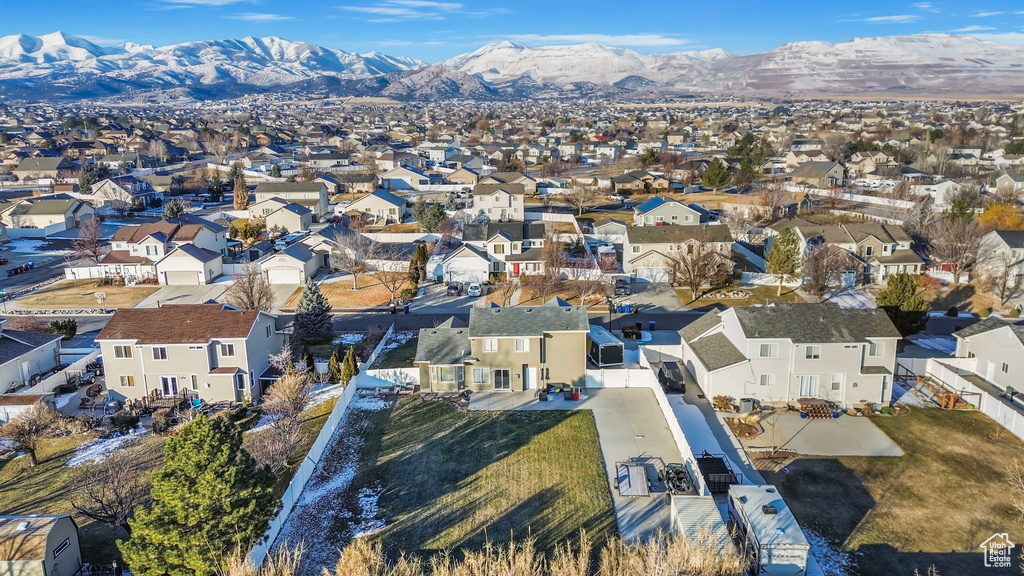 Drone / aerial view with a residential view and a mountain view