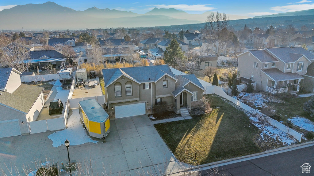 Birds eye view of property with a mountain view and a residential view