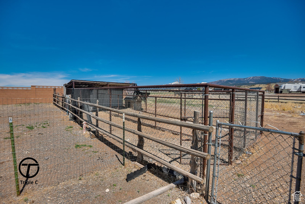 View of yard with a mountain view and an outbuilding
