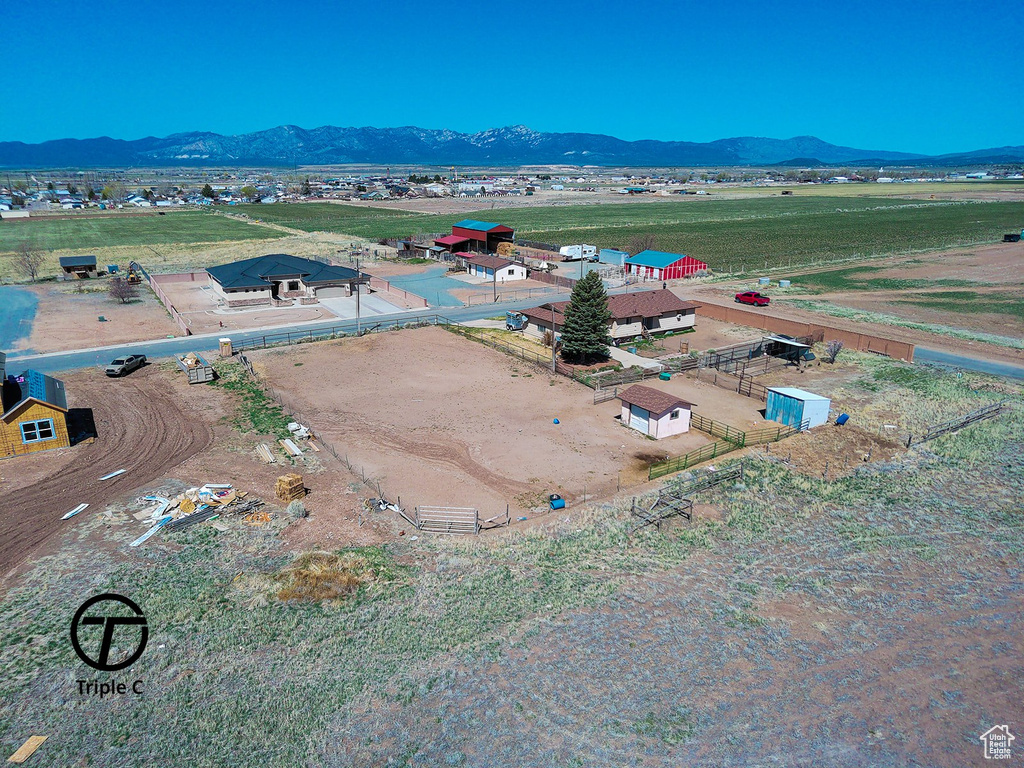 Birds eye view of property featuring a mountain view