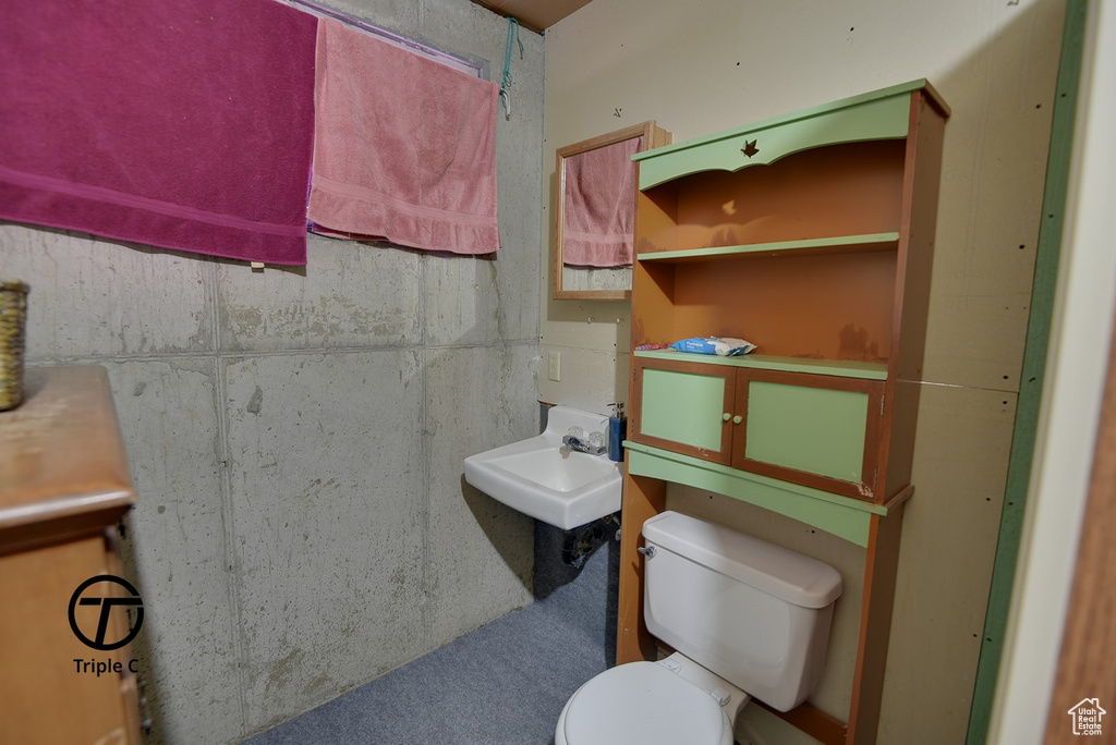 Half bath with a sink and toilet