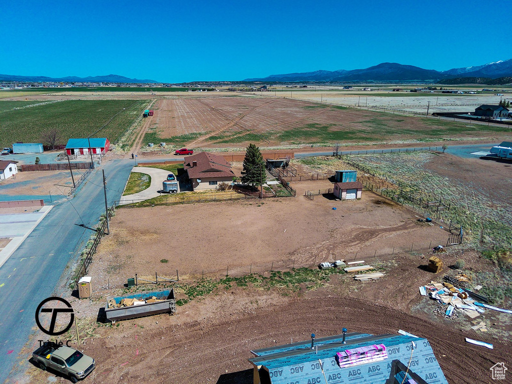 Aerial view featuring a rural view and a mountain view