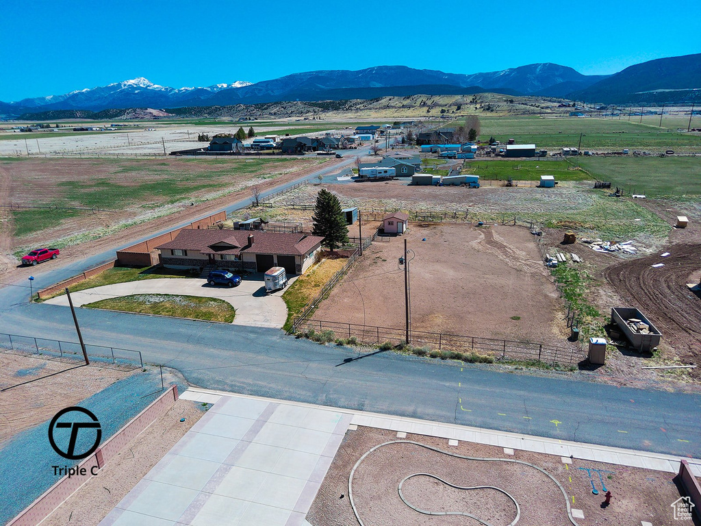 Drone / aerial view with a mountain view and a rural view