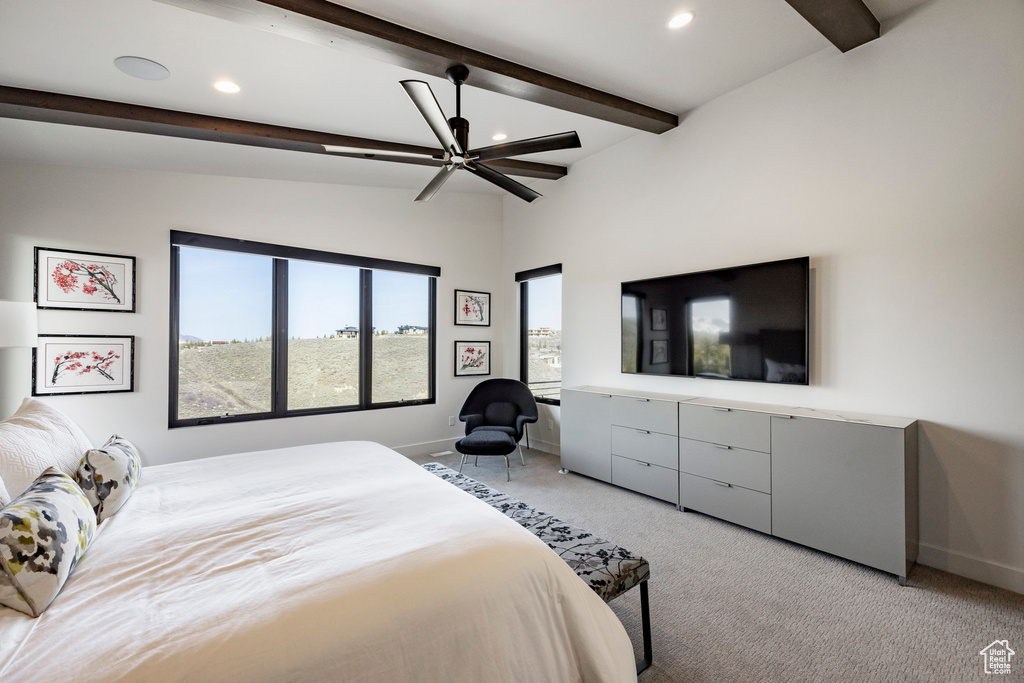 Carpeted bedroom featuring lofted ceiling with beams, ceiling fan, baseboards, and recessed lighting