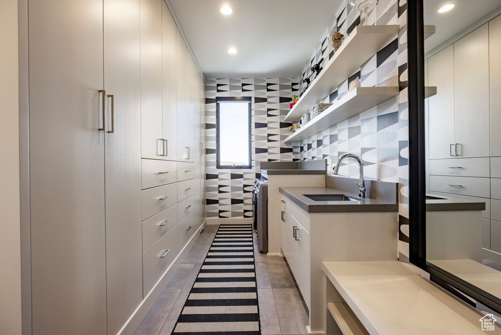Spacious closet featuring a sink