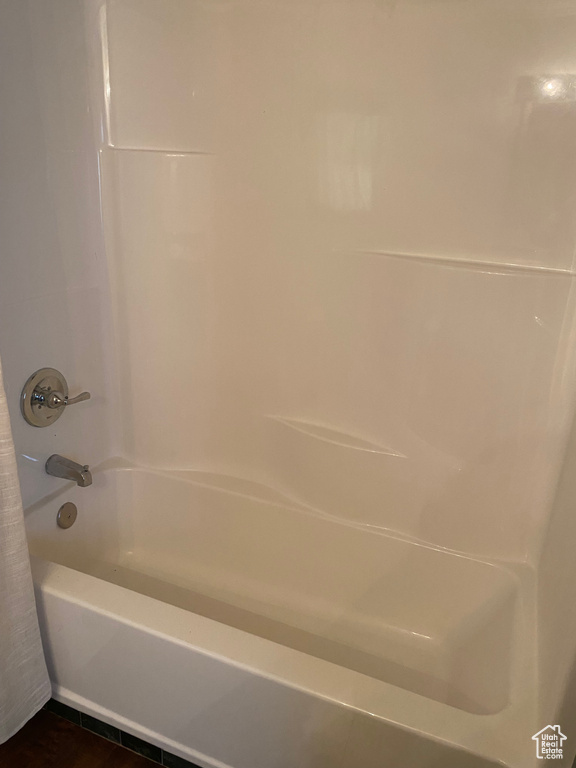 Bathroom featuring washtub / shower combination