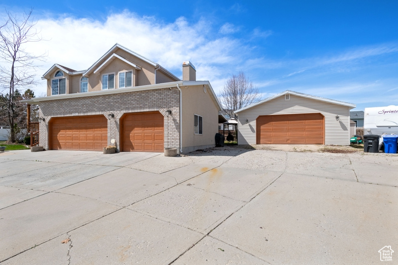 View of home\\\\\\\\\\\\\\\\\\\\\\\\\\\\\\\\\\\\\\\\\\\\\\\\\\\\\\\\\\\\\\\'s exterior featuring brick siding, an outbuilding, and a chimney