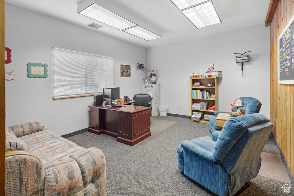 Carpeted office with visible vents