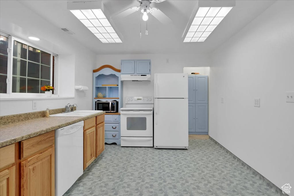 Kitchen with white appliances, a ceiling fan, open shelves, under cabinet range hood, and a sink