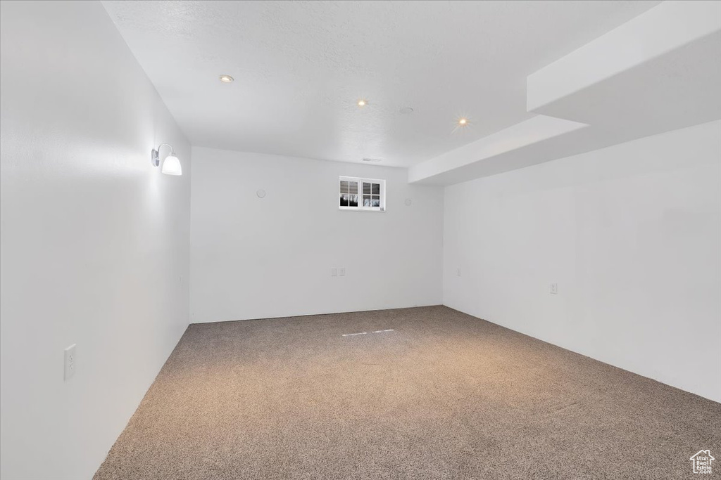 Empty room with recessed lighting and carpet floors