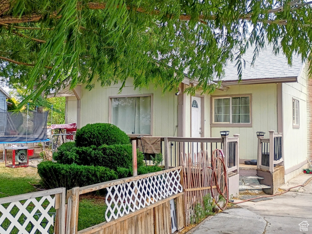 View of front of home with a trampoline
