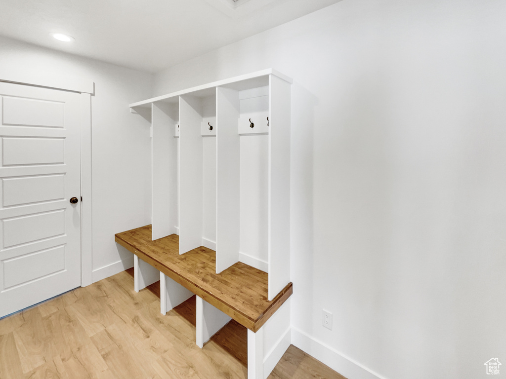 Mudroom with light wood-type flooring, baseboards, and recessed lighting