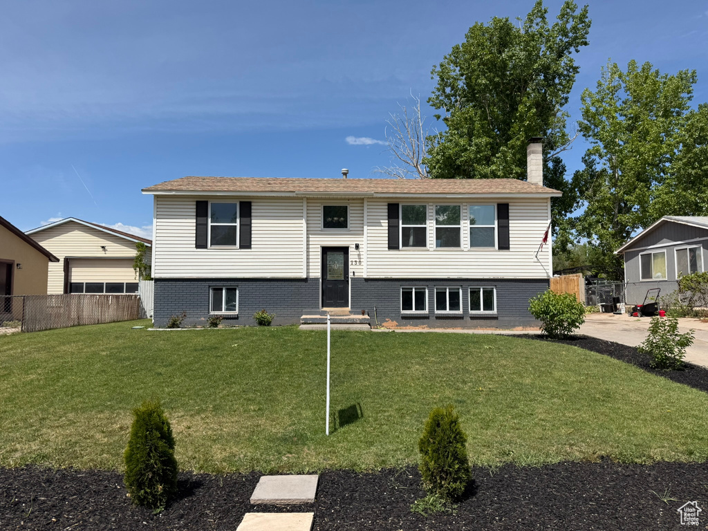 Raised ranch with a chimney and entry steps