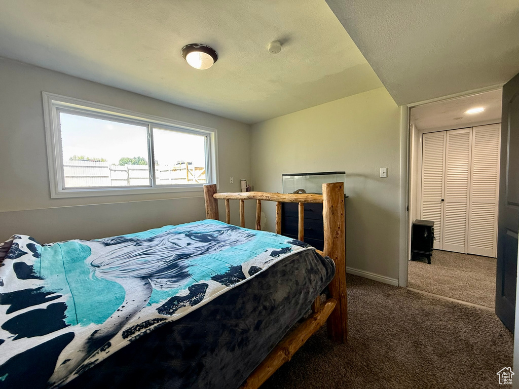 Bedroom with carpet flooring and baseboards