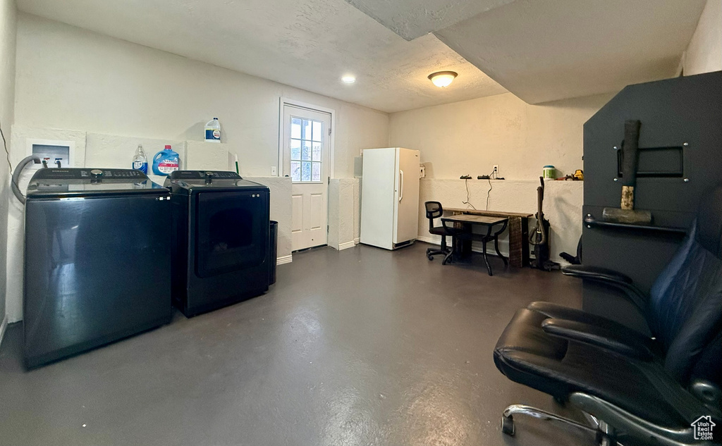 Washroom featuring washing machine and dryer
