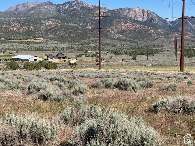 View of mountain background featuring rural landscape