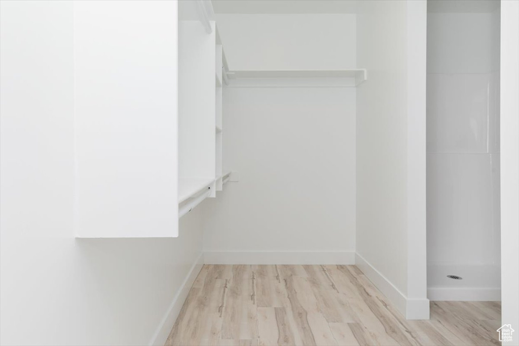 Spacious closet with wood finished floors