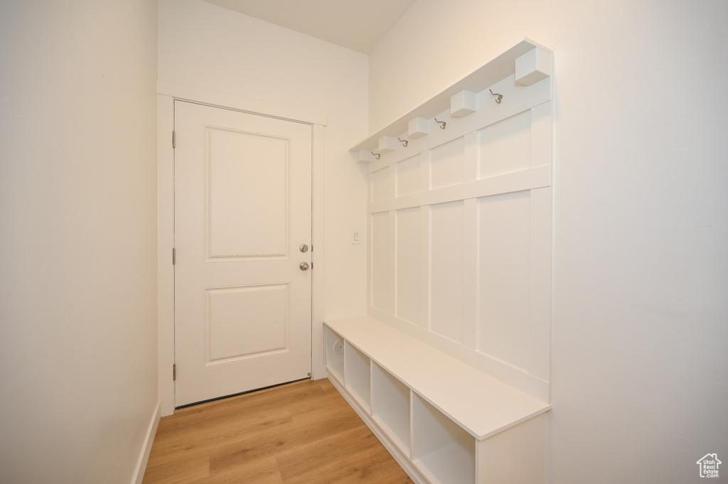 Mudroom featuring light wood-style floors