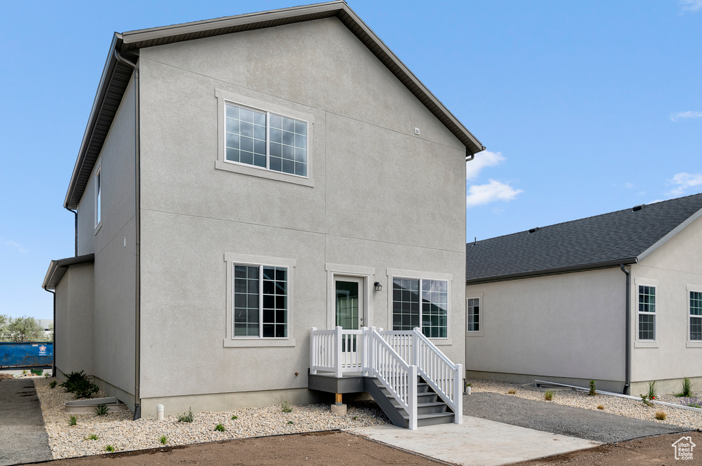 Back of property with stucco siding