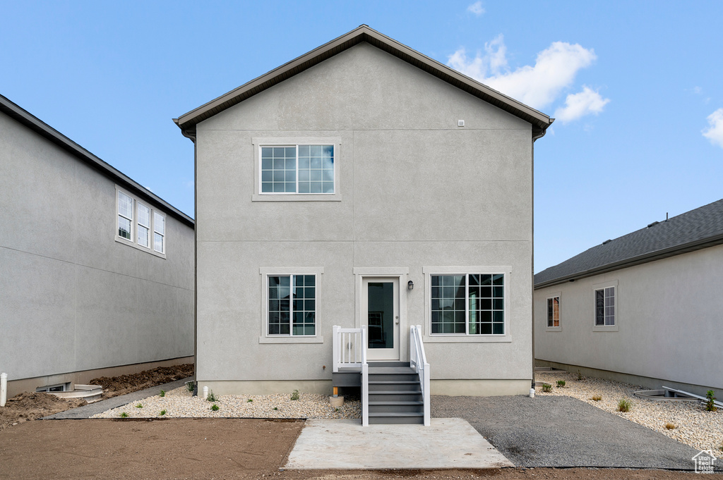 Back of property with stucco siding