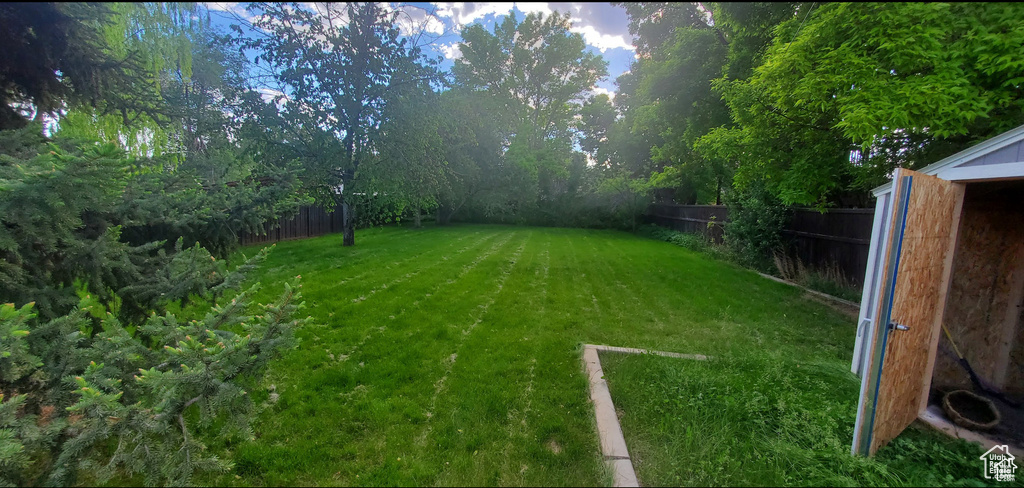 View of yard with a fenced backyard