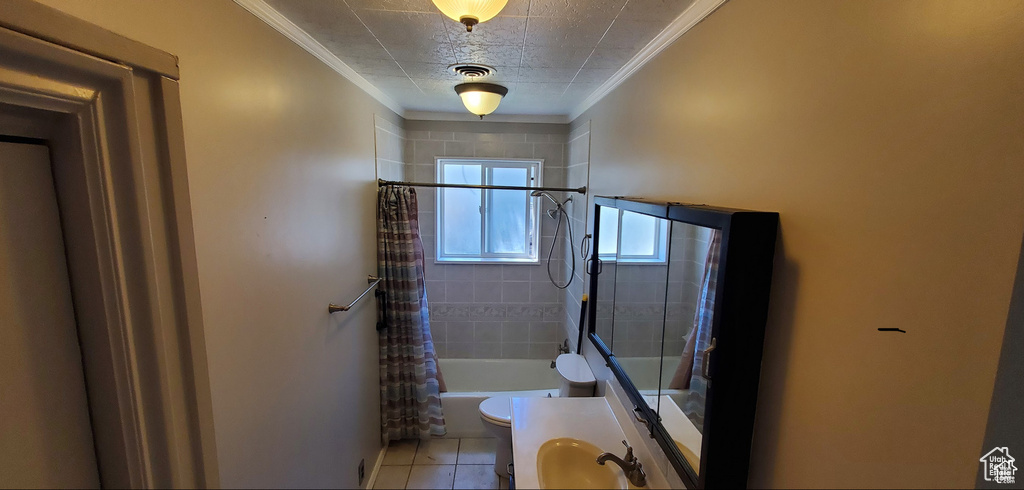 Bathroom with visible vents, shower / tub combo, ornamental molding, toilet, and tile patterned flooring