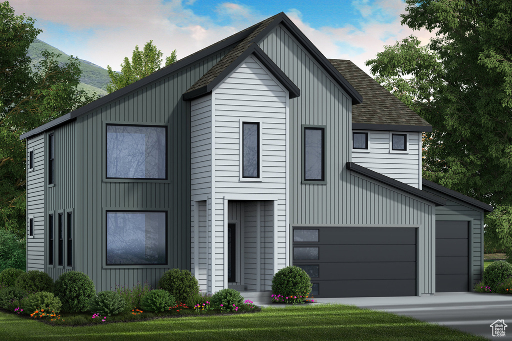Modern inspired farmhouse featuring board and batten siding, a mountain view, a shingled roof, and a garage