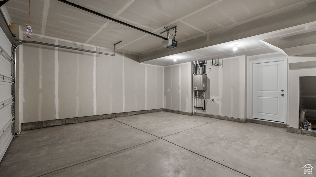 Garage with a garage door opener and water heater