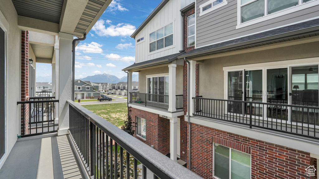Balcony with a mountain view and a residential view