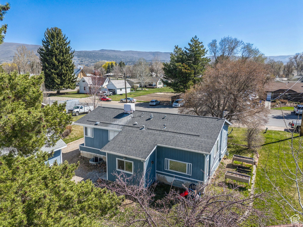 Birds eye view of property with a mountain view