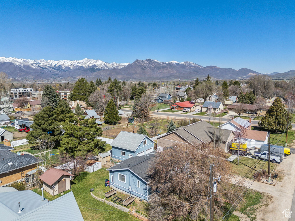 Birds eye view of property with a mountain view and a residential view