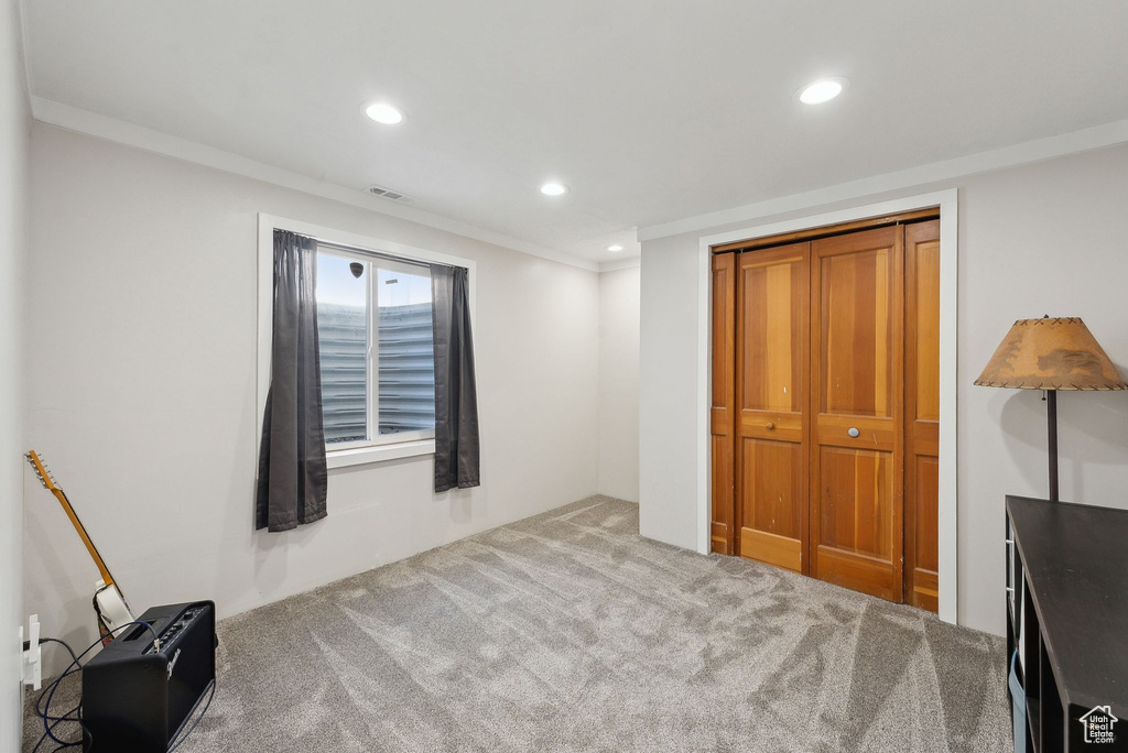 Bedroom with recessed lighting, carpet flooring, visible vents, and ornamental molding