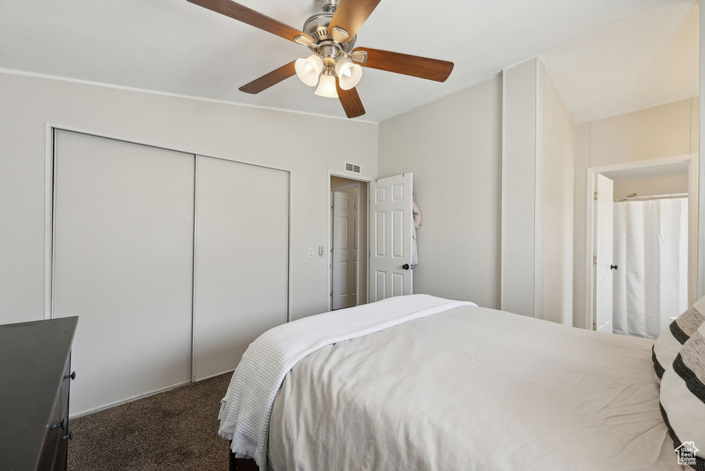 Bedroom with carpet flooring, a closet, and a ceiling fan