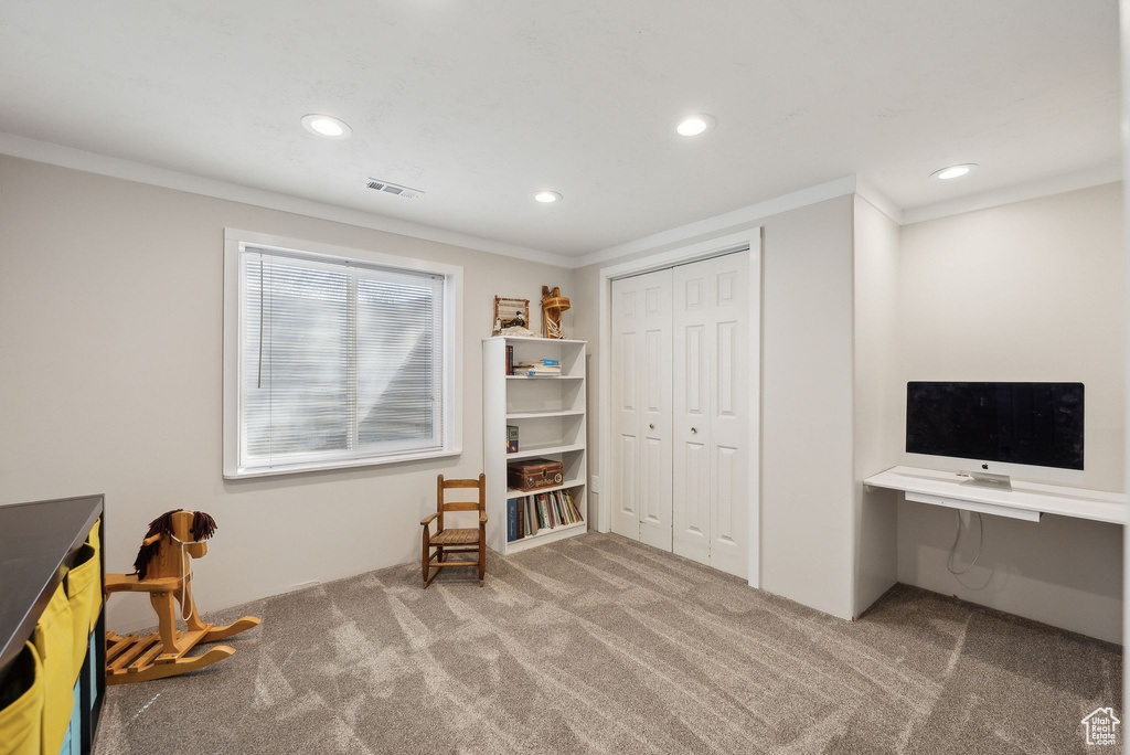 Interior space featuring recessed lighting, visible vents, ornamental molding, and carpet floors
