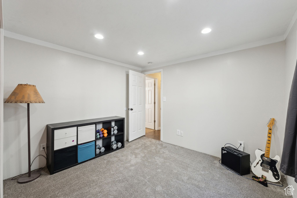 Recreation room featuring recessed lighting, carpet flooring, and ornamental molding