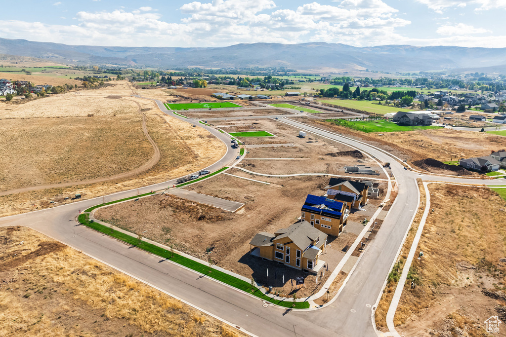 Birds eye view of property with a mountain view and a rural view