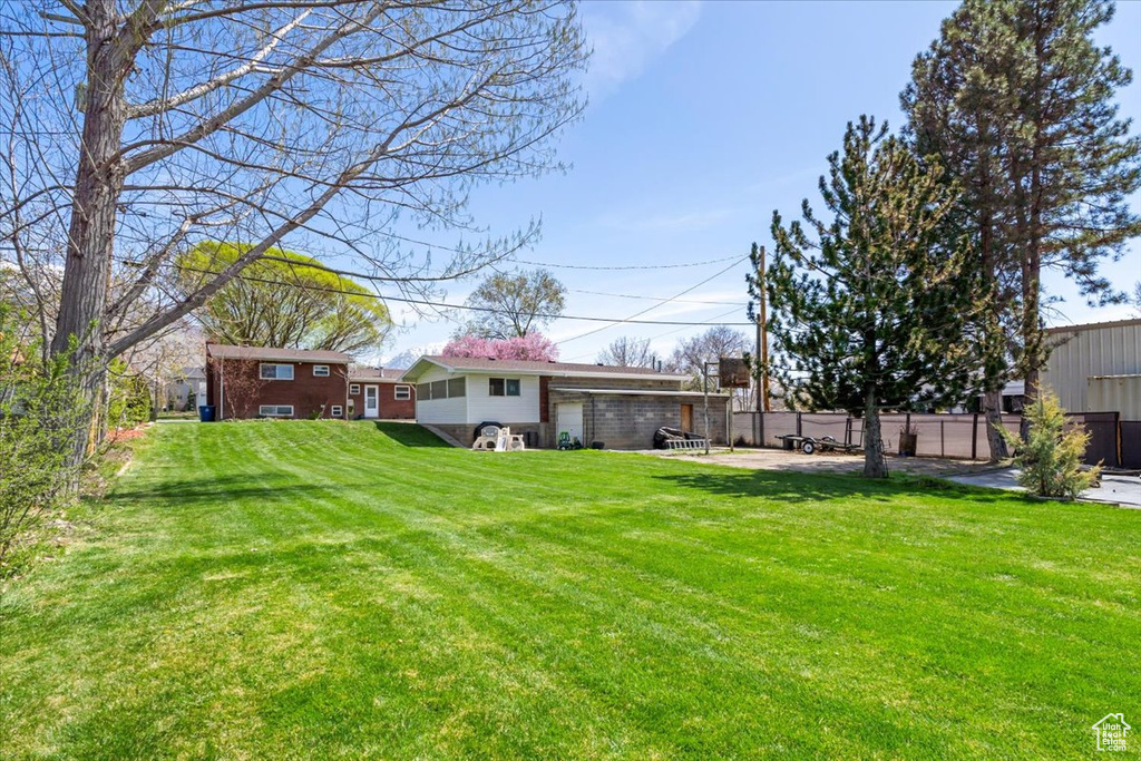 View of yard with fence