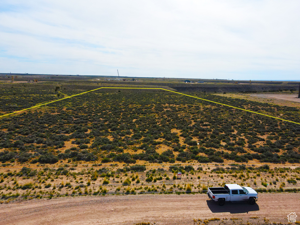 Birds eye view of property with a rural view